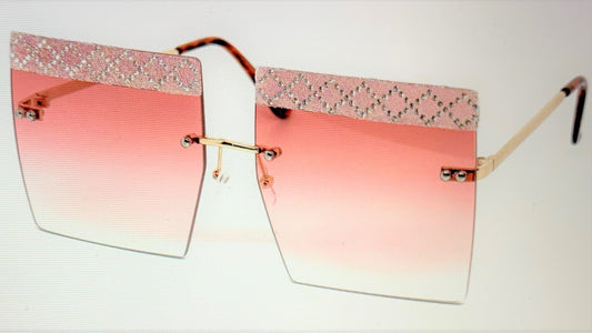 The high fashion oversized rimless square design with beautifully gradient lens and laced rhinestone eyebrows. Queens, you'll be looking as fine as wine, REAL TASTEE!