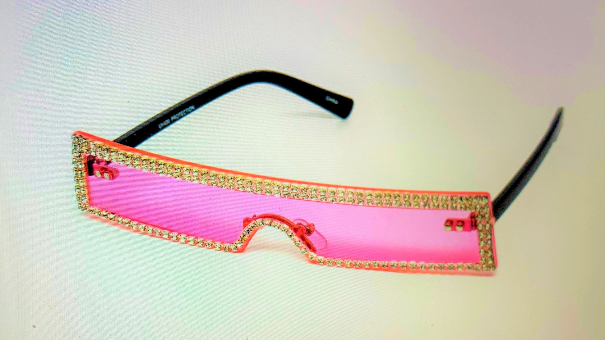 Wait a minute, don't forget the high fashion rhinestone slim color sunglasses.  The sunglasses has a thin high fashion cyber retro rectangular design with rhinestones infused borders and flexible acrylic frames.  They're screaming, SOPHISTICATED LADY! 